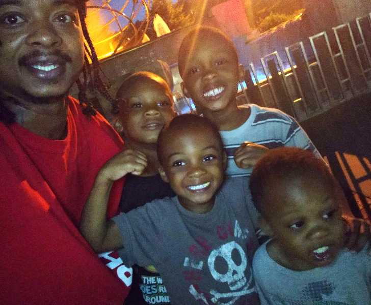 Picture of Jacob Blake with his four sons clicking selfie.